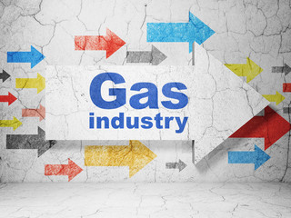 Manufacuring concept:  arrow with Gas Industry on grunge textured concrete wall background, 3D rendering