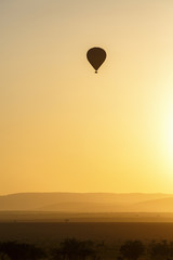 Air balloon over the African savannah at dawn