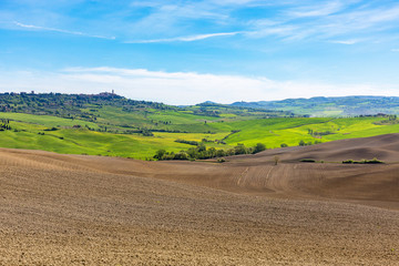 Fototapeta na wymiar Italian rural landscape in the spring with new sown field