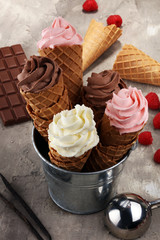 Vanilla frozen yogurt or soft ice cream in waffle cone.