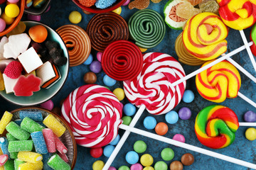 Fototapeta na wymiar candies with jelly and sugar. colorful array of different childs sweets and treats.