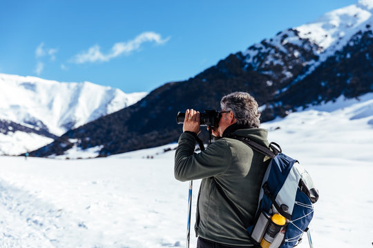 Photographer taking pictures in the snow