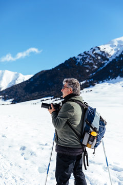 Photographer taking pictures in the snow