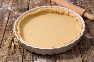 raw dough on wood background