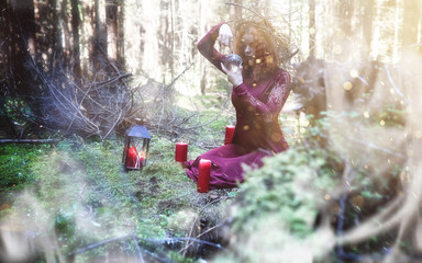 Witch ritual in a forest