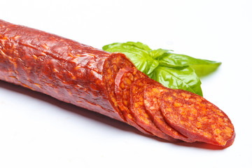 Spanish chorizo sausage on white background