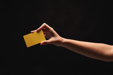 Closeup of female hand holding blank plastic card