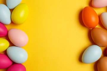 Colorful Easter eggs on a yellow background