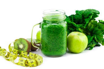 Green smoothie with spinach, apple, kiwi  and mint isolated in a jar mug on white background