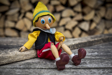 Old wooden pinocchio pupett marionette toy - obrazy, fototapety, plakaty