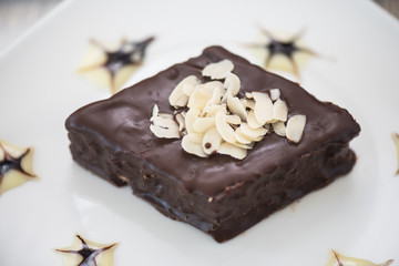 Chocolate cake on white plate, closeup