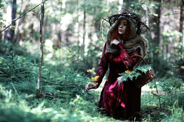 The red-haired witch holds a ritual with a crystal ball