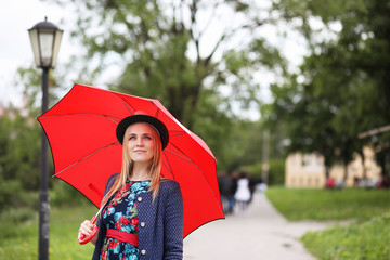 Girl in the street with an umbrella