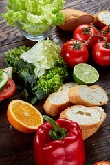 Lunch sandwich with cheese and vegetables served with citrus and coffee, selective focus, close-up, top view