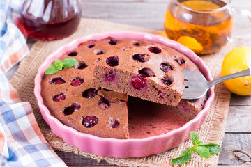 Chocolate pie with cherries in ceramic form