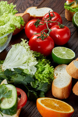 Lunch sandwich with cheese and vegetables served with citrus and coffee, selective focus, close-up, top view