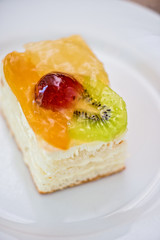 Colorful fruit supcake made with kiwi, grape and orange