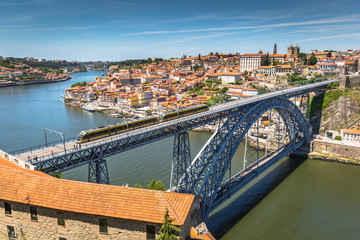 View of the historic city of Porto, Portugal with the Dom Luiz bridge.