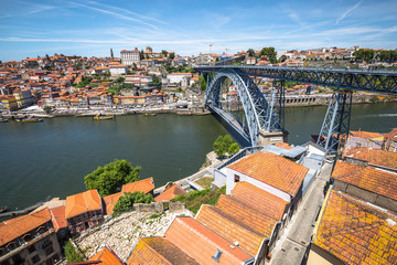 Fototapeta na wymiar View of the historic city of Porto, Portugal with the Dom Luiz bridge.