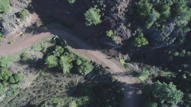 Aerial shot of riding dirt bike in Troodos Mountains in Cyprus