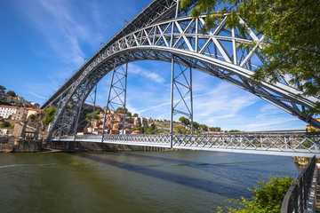City of Porto in Portugal. Ponte Luiz I Bridge over Douro river and historic architecture of the Old Town.