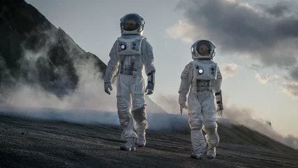 Foto op Canvas Two Astronauts in Space Suits Confidently Walking on Alien Planet, Exploration of the the Planet's Surface. In the Background Research Base/ Station and Rover. Space Travel, Colonization Concept. © Gorodenkoff