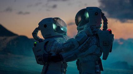 Two Astronauts in Space Suits Hugging on Alien Planet, Exploration of the the Planet's Surface....