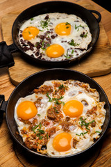 Fried eggs for breakfast. Pan of fried eggs with bacon. English breakfast