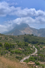 Fototapeta premium Scenic Mountains Overlook Landscape with a road. Cloudy summer day. Spain.