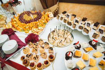 Different kinds of baked sweets on a buffet