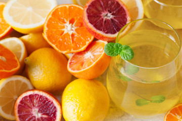 Detox citrus water, refreshing summer homemade lemonade cocktail with lemon and orange