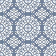 Abstract seamless pattern of dots and curls.