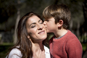 Fototapeta premium Mother with her children in the park