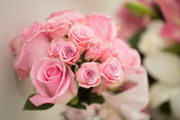 Pink flower bouquet closeup. Couples anniversary concept. Detail bouquet with blurred background. Beautiful pink flowers in a hotel room.