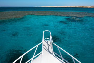 View at the coral sea from white yacht. Perfect place for snorkeling.