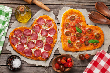 Heart shaped pizza with tomatoes and mozzarella and pepperoni