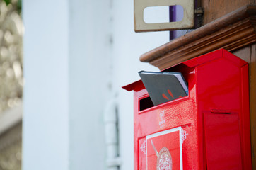 Red mailbox with book.