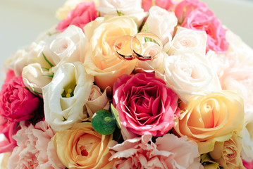 wedding bouquet of flowers with rings of the newlyweds