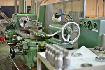 Turning products from metal on the rack against the background of the machine. Details with a notch on the side.