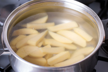 Cut potatoes in a saucepan with starting water to boil.