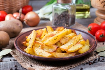 Roasted potato wedges with herbs in a rustic style