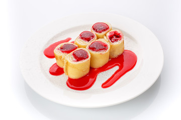 Fresh sweet homemade pancakes with cheese and strawberry sauce