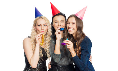 happy women with party caps hugging