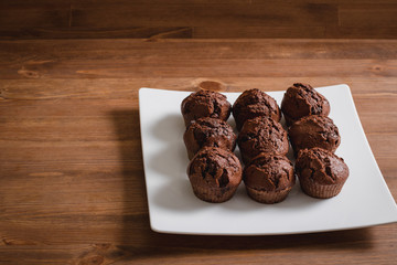 chocolate muffins on a wooden table