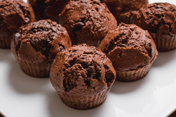 chocolate muffins on a wooden table