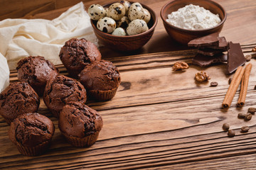 chocolate muffins on a wooden table
