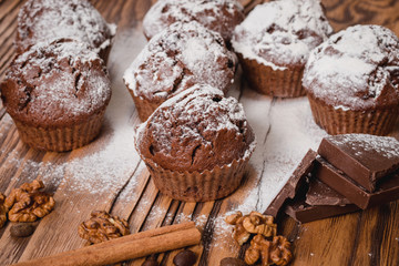 chocolate muffins on a wooden table