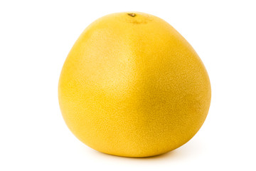 Ripe pomelo on a white, close-up.