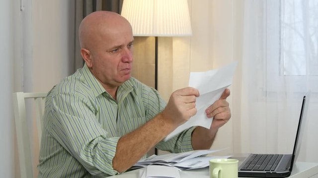 Disappointed Businessman Check Invoices and Calculate Payments