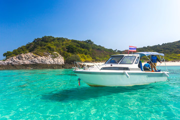 Fototapeta na wymiar Yacht in the sea around the island on a background of blue sky , Thailand, Copy space.